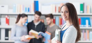 student holding books