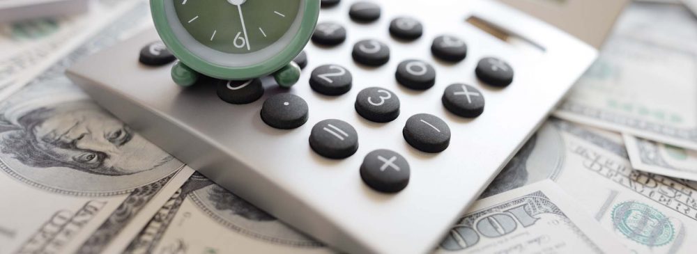 Calculator and alarm clock over money